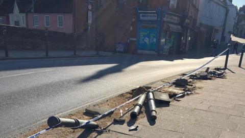 Bollards knocked down in Fye Bridge Street, with takeaway shop and Wensum Street in background