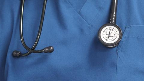 Doctor's blue outfit with black stethoscope