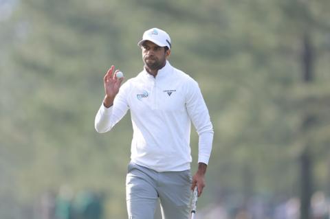 England's Aaron Rai acknowledges the crowd after holing a birdie putt at Augusta