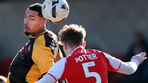 Courtney Baker-Richardson of Newport (left) and Finley Potter of Fleetwood