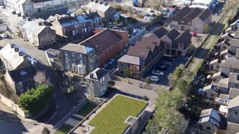 An aerial design image showing a mix of new and old buildings in Penistone