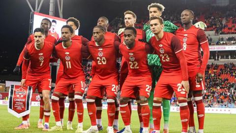 Canada players pose for a team photo before a friendly against Ecuador in 2025