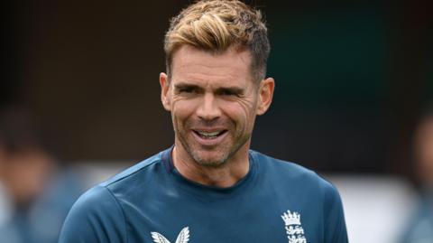 James Anderson wearing an England training top