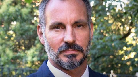 A headshot of Prince Rahim Al-Hussaini