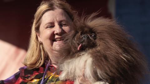 Wild Thang and his owner Anne Lewis on stage after being announced as the first place winner.