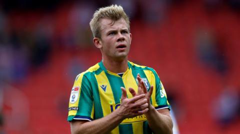 Striker Aune Heggbo applauding West Bromwich Albion fans