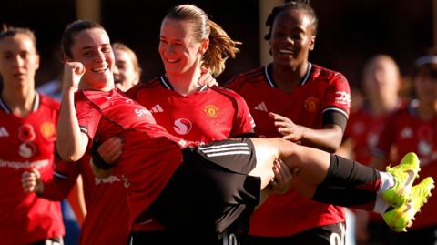 Elisabeth Terland celebrates with Ella Toone