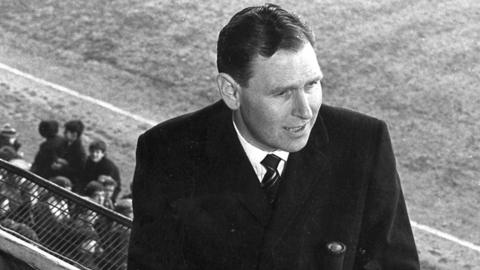 Kenneth Wolstenholme presents an in-vision link to camera before the match between West Ham United and Sheffield United on 19 February 1966. 