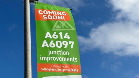 A sign about road improvements along the A614