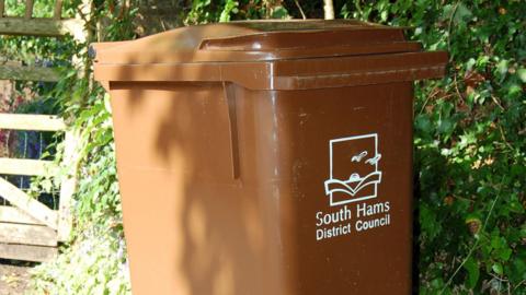 A picture of the brown bin provided by South Hams District Council. The bin has the logo on the front of it.