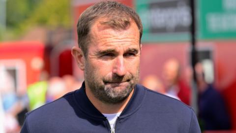 Manager Paul Wotton watching National League South football for Torquay United against Hemel Hempstead