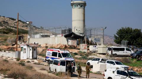 Israeli soldiers and emergency personnel at the scene of a shooting attack on a military post next to the Tayasir checkpoint, in the occupied West Bank, in which two soldiers were killed (4 February 2025)