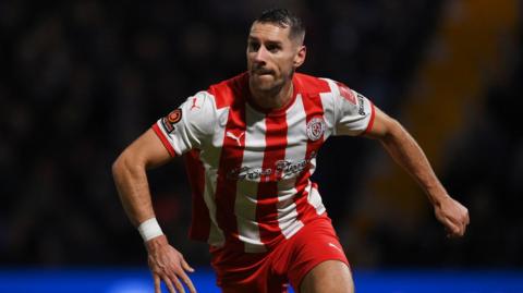 Matt Lowe playing for Brackley Town against Notts County
