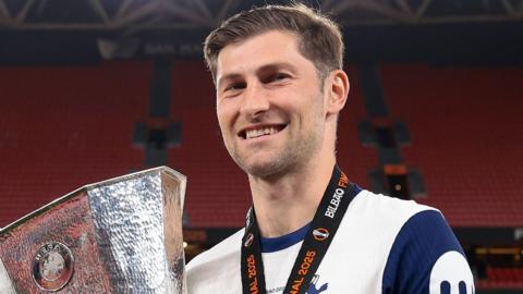 Ben Davies with the Europa League trophy