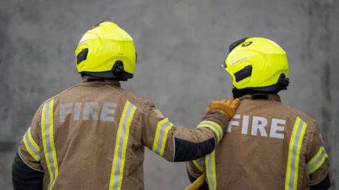 Image of two firefighters