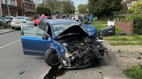 Crash with damaged car in the foreground