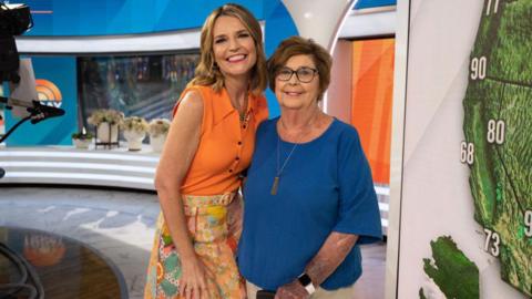 Nancy Guthrie smiles for a photo with her daughter Savannah Guthrie in the Today show studio. 