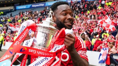 Shayden Morris holding the Scottish Cup after last season's final