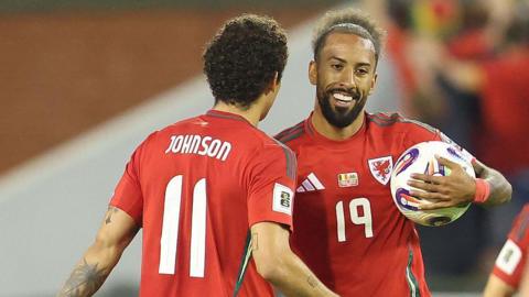 Brennan Johnson and Sorba Thomas celebrate