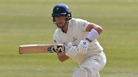 Asa Tribe playing a shot into the onside for Glamorgan