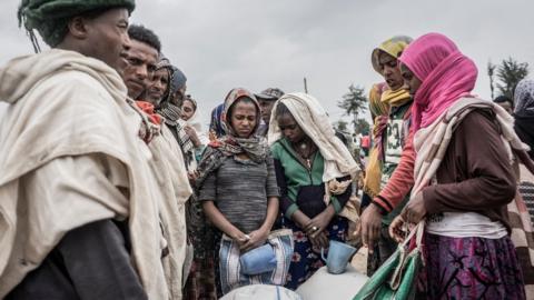 Internally displaced people (IDP) camp waiting to receive food from the World Food Programme (WFP) in Debark, Ethiopia, on September 15, 2021.