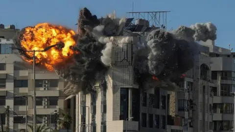 An explosion takes place in a building following an Israeli strike, amid escalating hostilities between Israel and Hezbollah, as the U.S.-Israel conflict with Iran continues, in Beirut, Lebanon, March 31, 2026