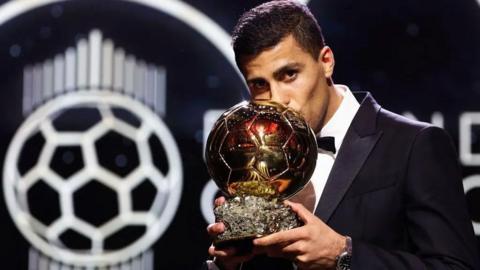 Rodri with Ballon d'or trophy