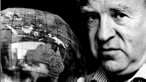 File image of Arthur Frommer with a globe