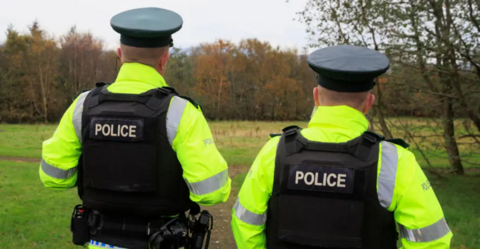 A generic image of two police officers seen from behind 
