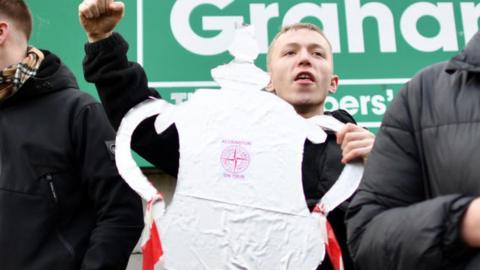 Accrington Stanley fan holding tin foil FA Cup trophy