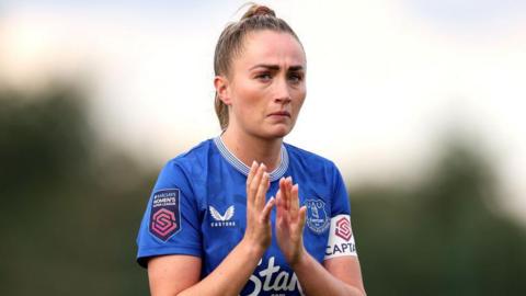 Megan Finnigan applauds during an Everton game
