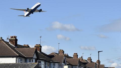 Plane comes in to land at Heathrow