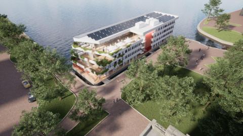 A artist's impression of the floating hotel shows it moored to the end of Roath Basin near Britannia Park, which has trees, grass and paths along the quay. The hotel itself looked like a cruise ship, with just a flat bow and stern. It is white, four-storeys tall and has a terrace and solar panels on the roof. 