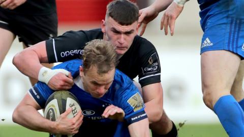 Ulster A's Ben Moxham tackles Leinster A's Niall Comerford at Kingspan Stadium