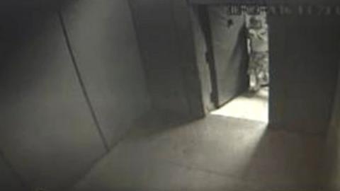 Still of an empty solitary room taken from CCTV footage.
