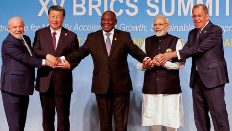 President of Brazil Luiz Inacio Lula da Silva, President of China Xi Jinping, South African President Cyril Ramaphosa, Prime Minister of India Narendra Modi and Russia's Foreign Minister Sergei Lavrov pose for a BRICS family photo during the 2023 BRICS Summit at the Sandton Convention Centre