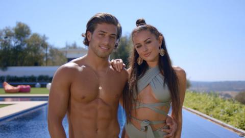 This is a photo of Kem and Amber, a couple on Love Island.