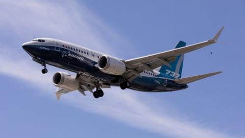 A Boeing 737 MAX airplane lands after a test flight at Boeing Field in Seattle.