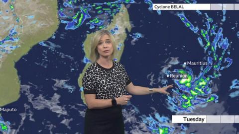 Sarah Keith-Lucas standing in front of a weather map