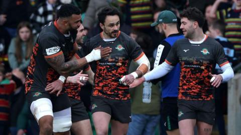 Ealing players celebrate scoring a try in their win over Northampton Saints