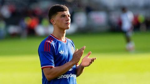 Manchester United forward Shea Lacey applauding