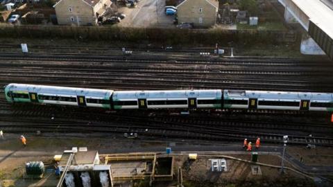 A photo of a derailed train taken from above