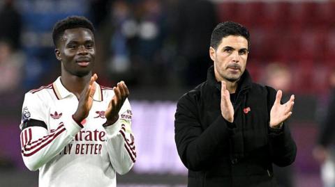 Bukayo Saka and Mikel Arteta