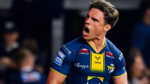 Brodie Croft celebrates scoring a try for Leeds Rhinos against Catalans Dragons