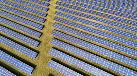 Solar panels a solar farm development in Dunmow photographed from above.