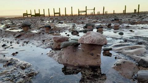 Anchorsholme beach showing where sand has migrated exposing clay and cobbles