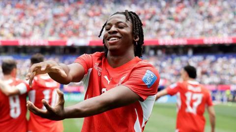 Johan Manzambi celebrates after scoring for Switzerland at the World Cup