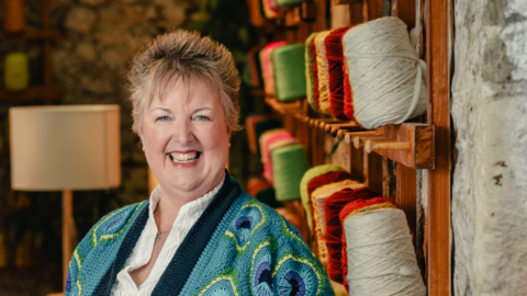 Stephanie was chosen from thousands of contestants to take part in the series. She is pictured wearing a green colourful knitted cardigan