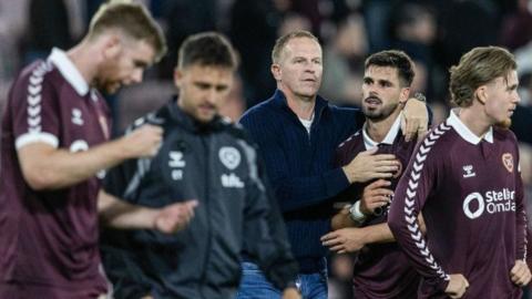 Wouter Vrancken embraces Hearts striker Claudio Braga