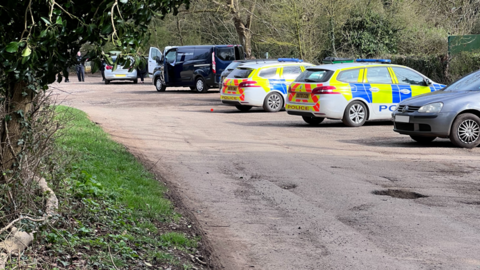 Police cars at country park